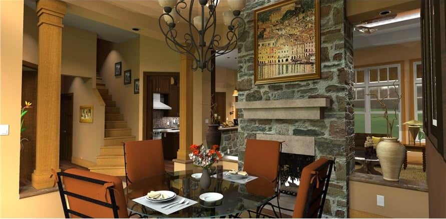 Formal dining room with cushioned chairs and a glass top dining table well-lit by an ornate chandelier.