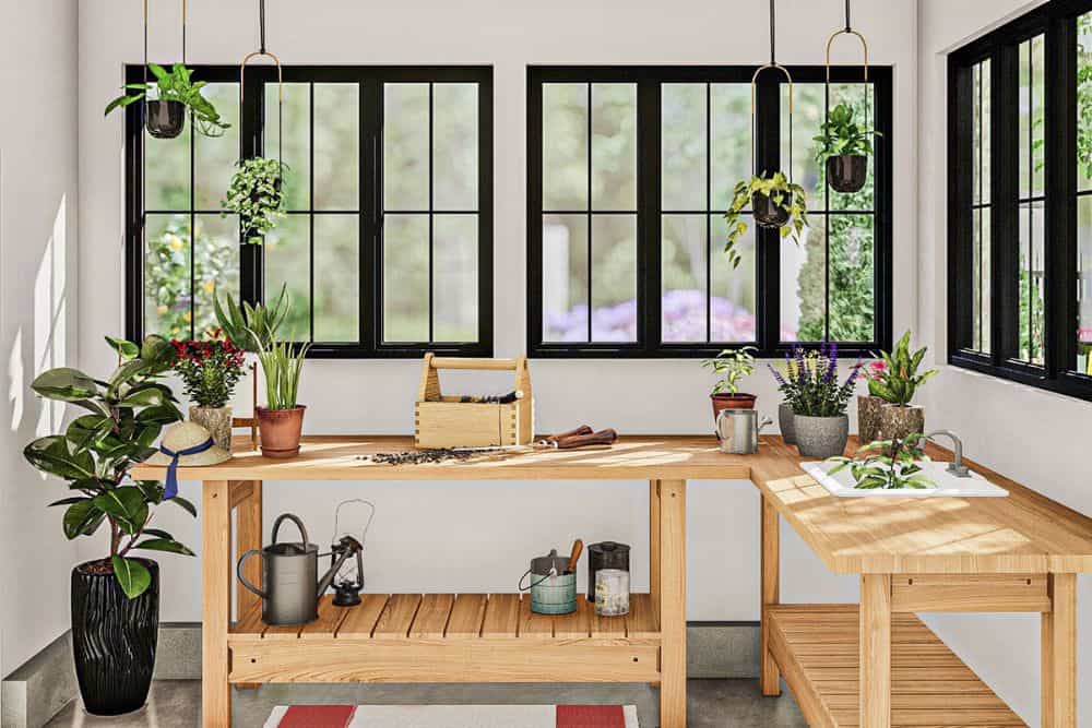 Garden shed with wooden counters, a porcelain sink, and surrounding windows bringing natural light in.