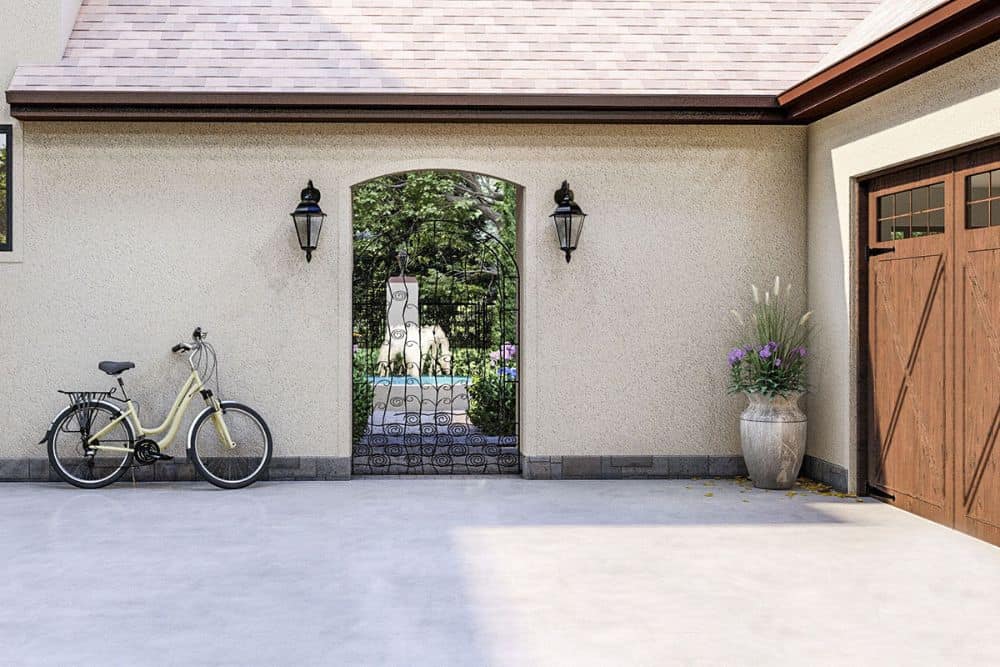 A concrete driveway complements the double garage.