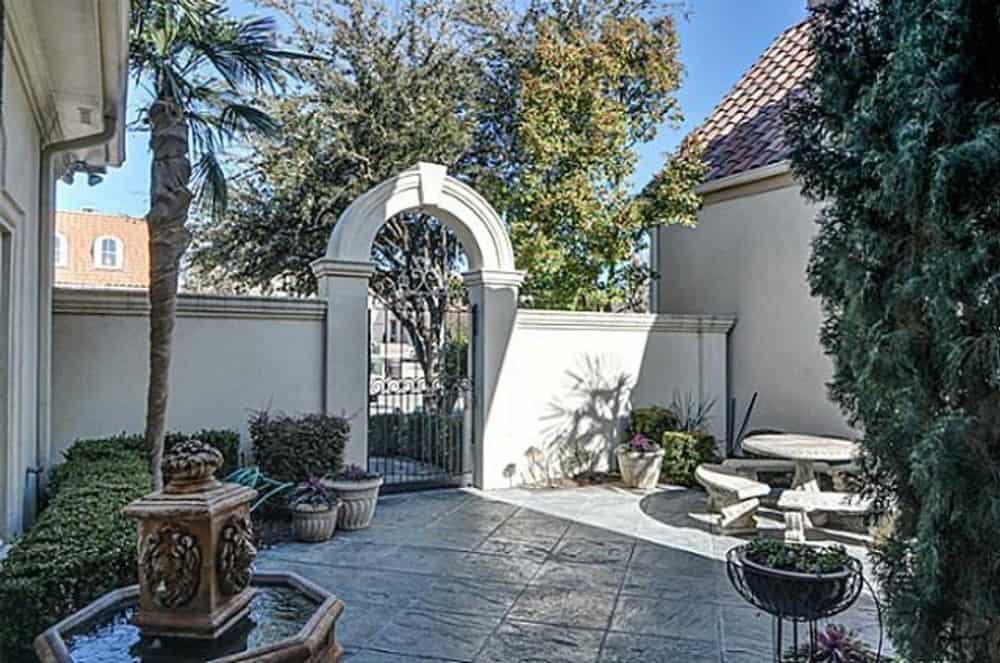 The house is privately enclosed in a concrete fence with a wrought iron gate.The house is privately enclosed in a concrete fence with a wrought iron gate.