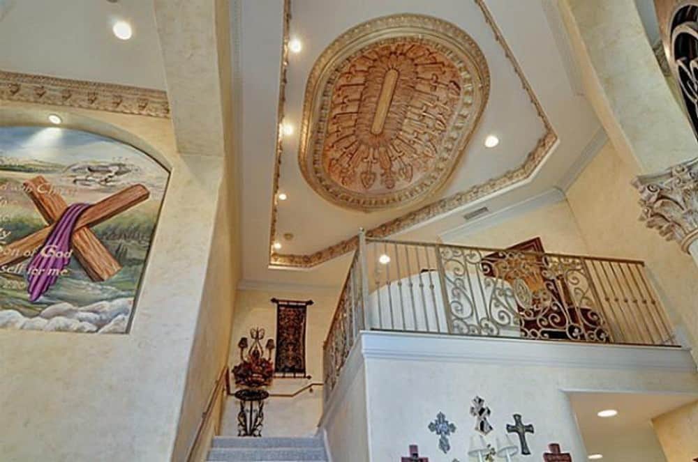 A stunning tray ceiling with intricate detailing crowns the second-level loft.