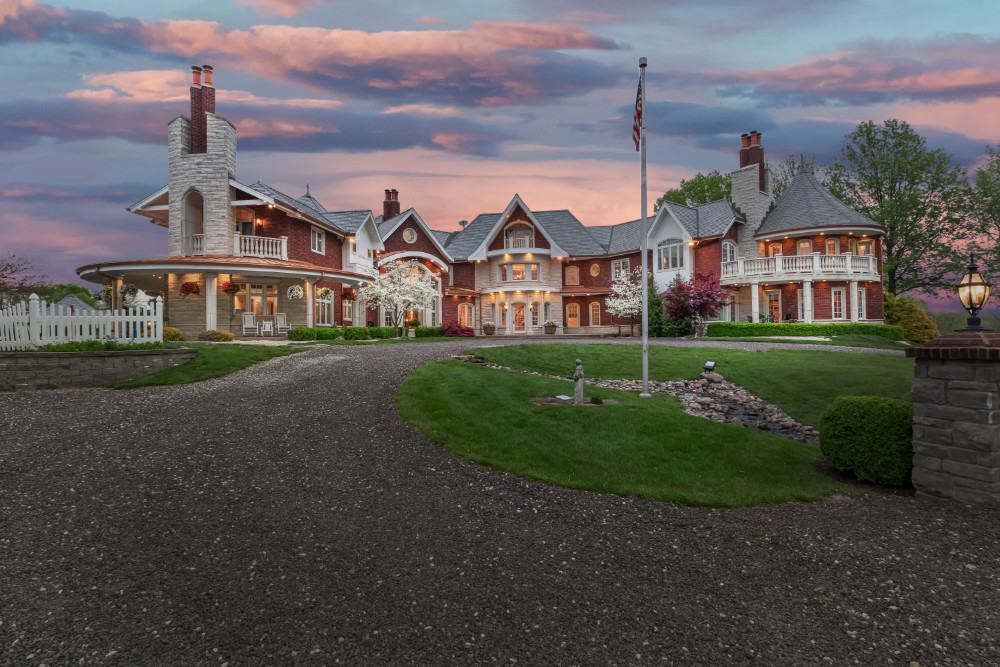 A closer view shows the covered porches and expansive balconies. Image courtesy of Toptenrealestatedeals.com.