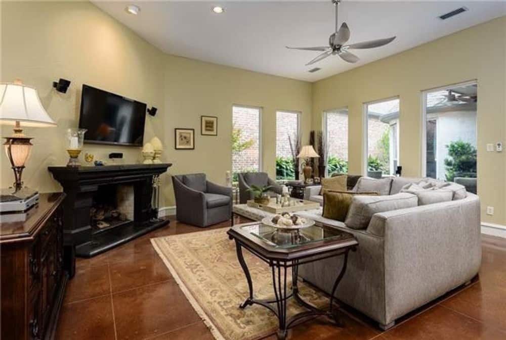 Sleek tall windows bathe the family room with natural light.