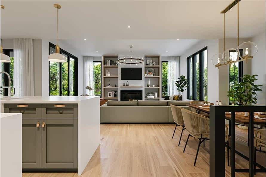 An open layout view of the kitchen, dining area, and bright living room.