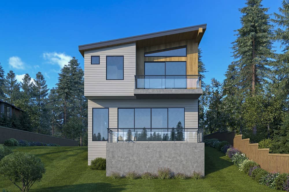 Rear exterior view with upper and lower balconies bordered with glass railings.