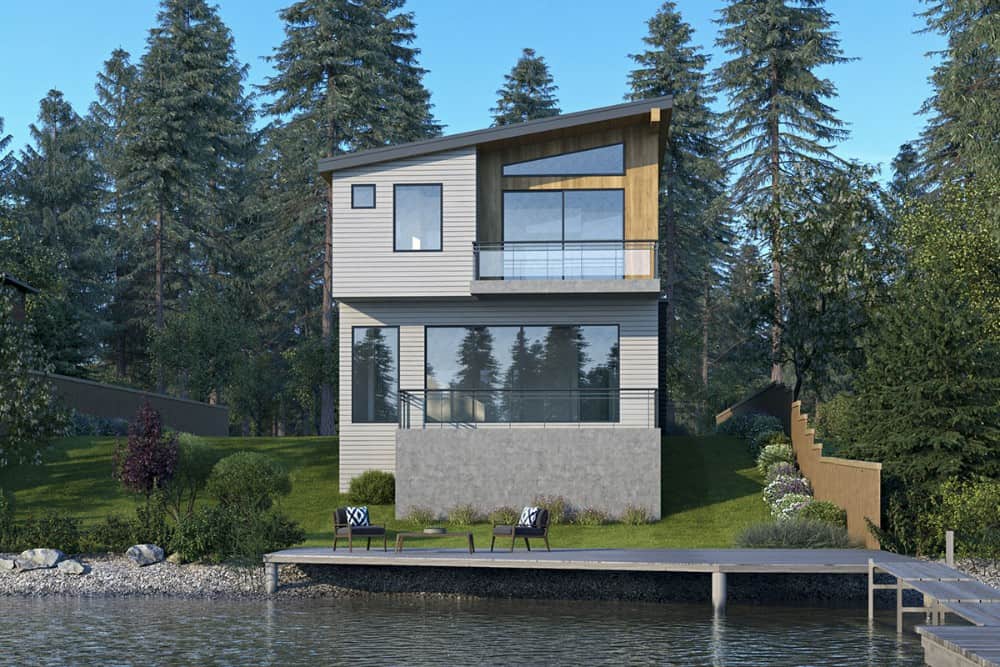A farther view shows the private dock and deck complemented with cushioned lounge chairs.