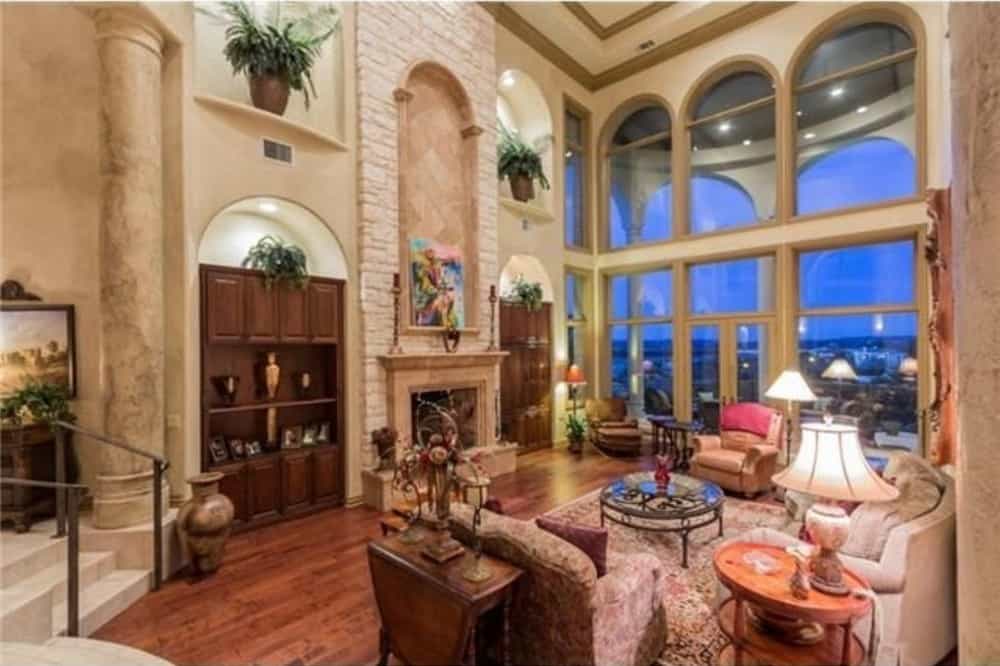Massive windows at the rear wall take in ample natural light along with impressive views of the surrounding landscape.