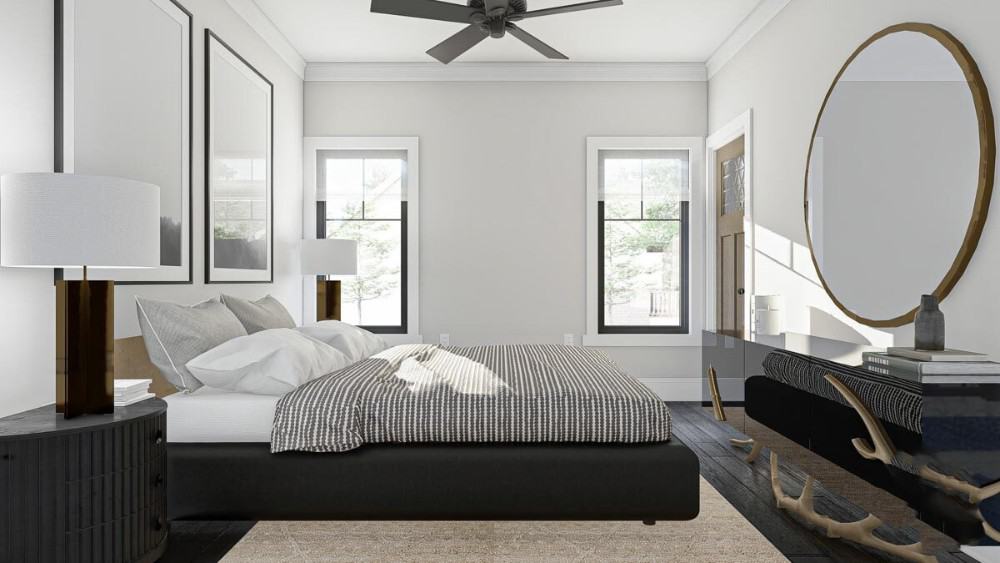 This bedroom has a ceiling fan and a platform bed facing the sleek mirrored console table.