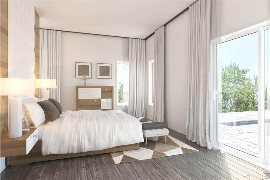 Primary bedroom with a wooden platform bed, a patterned area rug, and direct pool access through sliding glass doors.