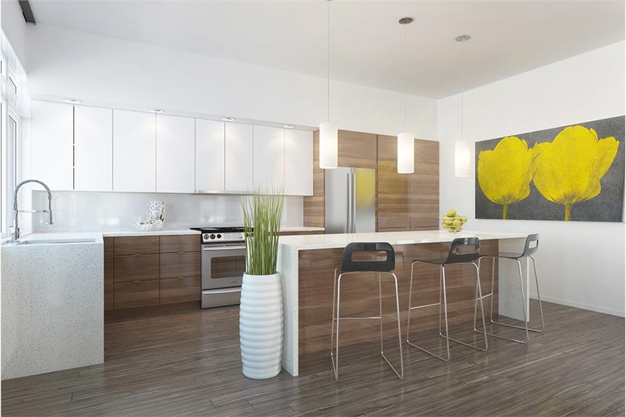 A large artwork along with a potted plant sitting beside the island adorn the white kitchen.