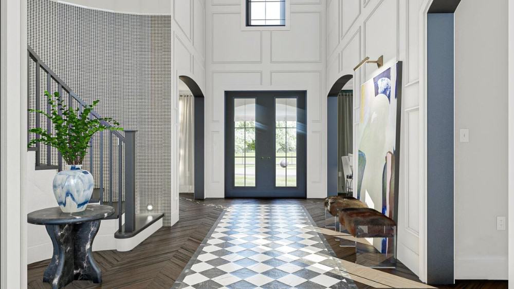Foyer with a soaring ceiling, full-height wainscoting, cushioned bench, and a round marble table