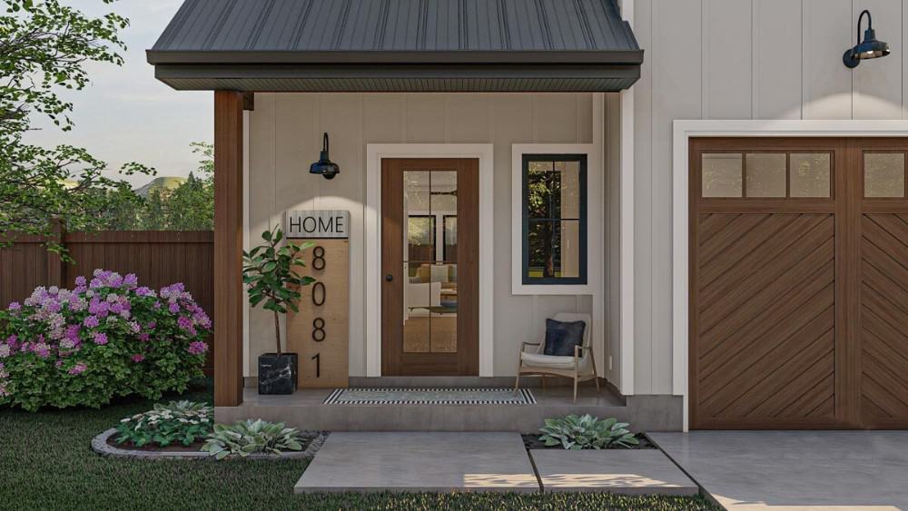 Covered entry porch with a cushioned armchair, a striped runner, and a glazed front door.