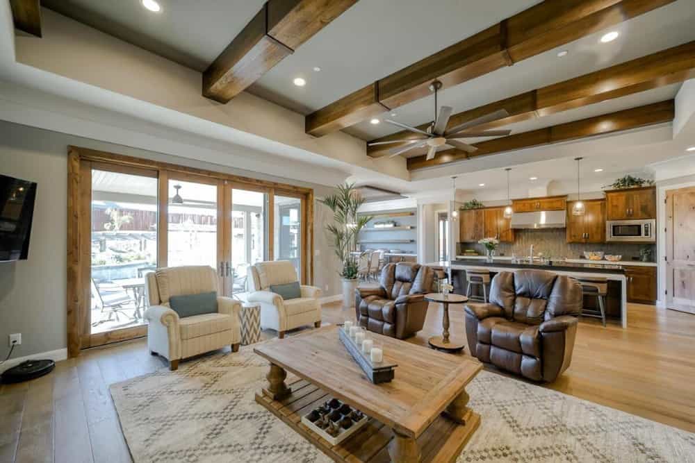 The great room opens completely to the eat-in kitchen. French door on its side leads to the rear patio.