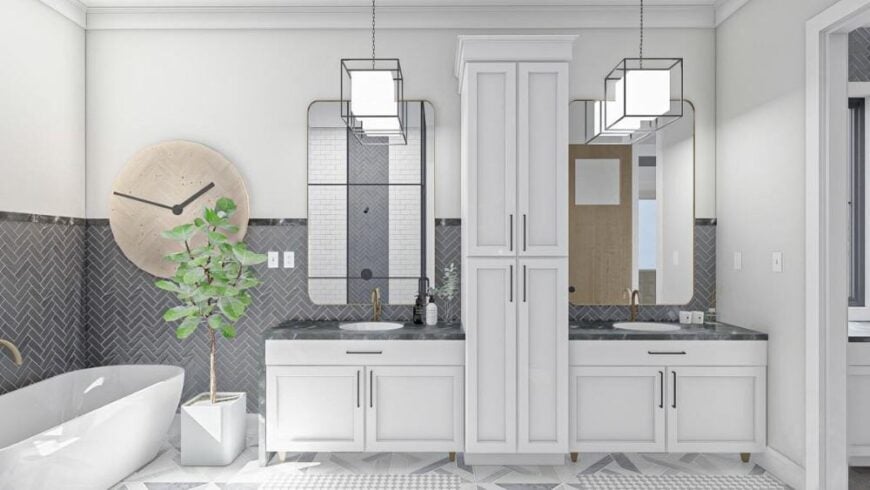 Primary bathroom with a freestanding tub along with his and her sink vanities separated by a linen closet.