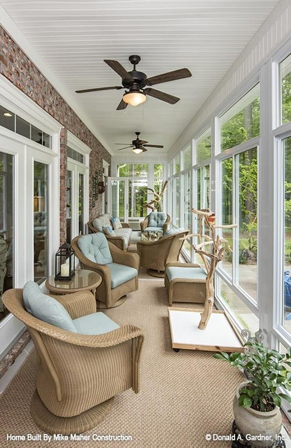 Mudroom with storage cabinets, a built-in bench, a round pendant light, and easy access to the powder room.