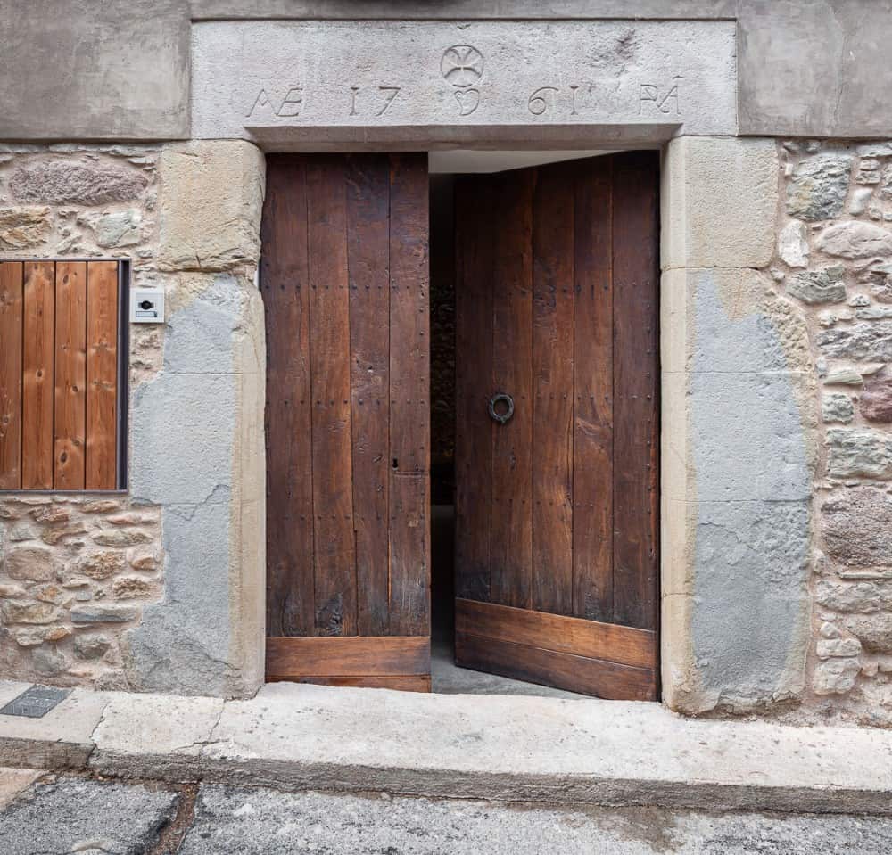 A main door made up on wood of trees.