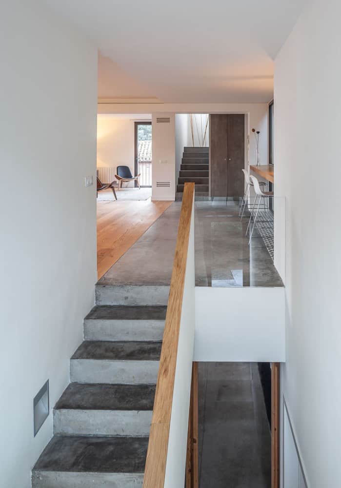 A two stairs on living and study room with wooden cabinet.