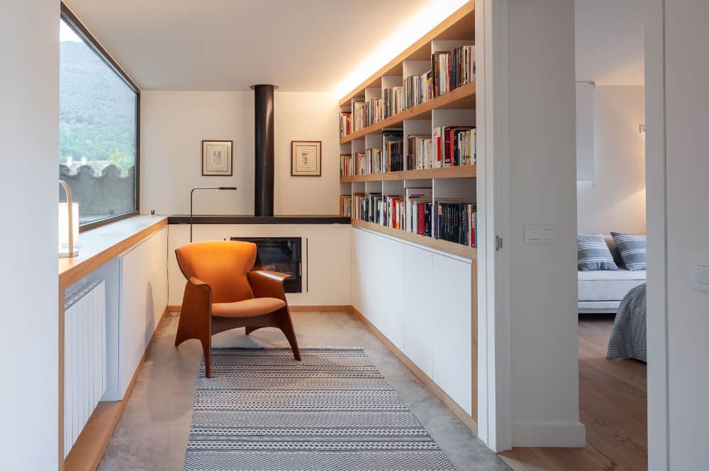 A study room with chair and book shelves made on wooden.