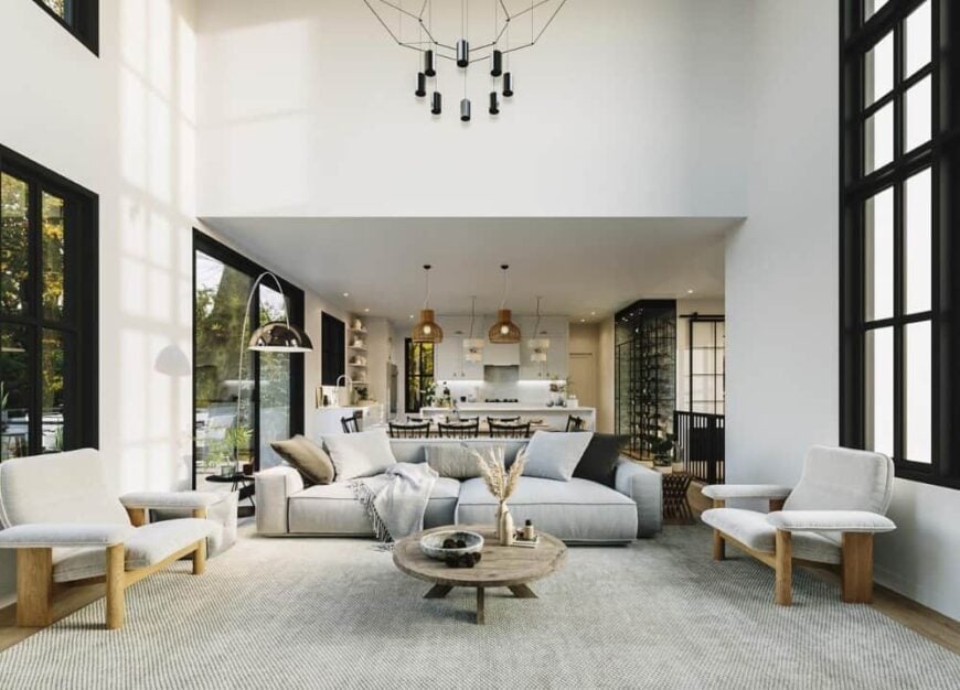 A two-story ceiling graced with a contemporary chandelier crowns the living room.A two-story ceiling graced with a contemporary chandelier crowns the living room.