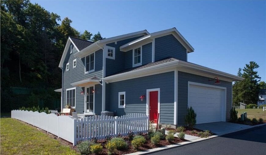 Rear exterior view showing the double garage encased in a large white door.