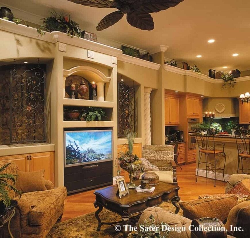 Leisure room with cozy seats and a TV flanked by built-in cabinets.