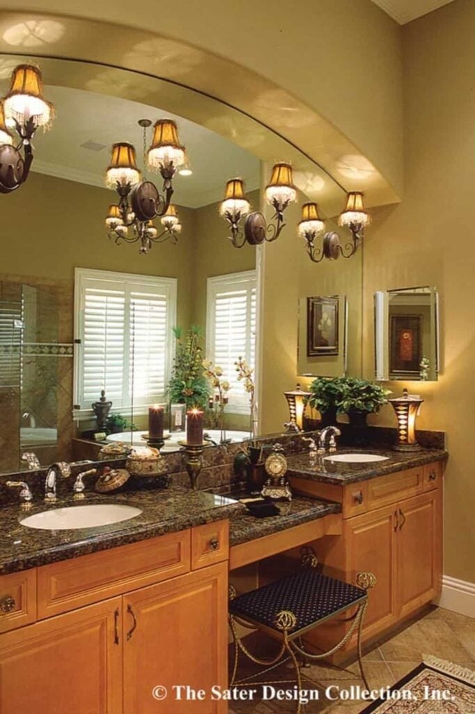The primary bathroom features a dual sink vanity with a makeup counter in the middle.