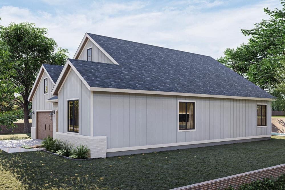 Right exterior view showcasing its board and batten siding, stone base, and sliding glass windows.
