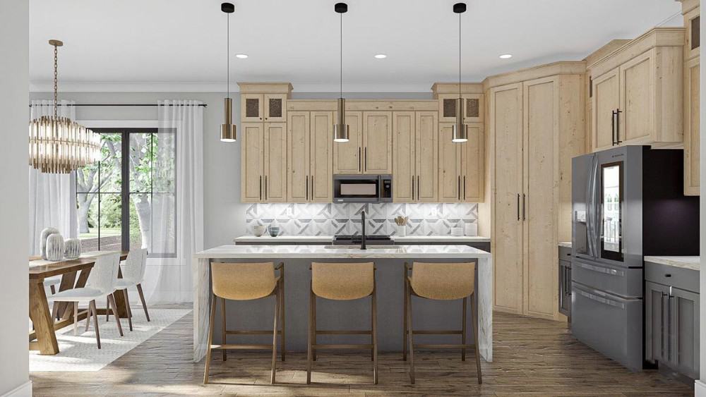 Kitchen with light wood cabinetry, slate appliances, and a breakfast island lined with wooden bar stools.