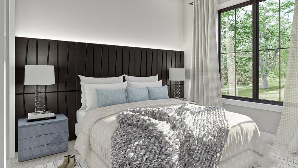 Bedroom with a large window and a comfy bed with a custom black headboard.