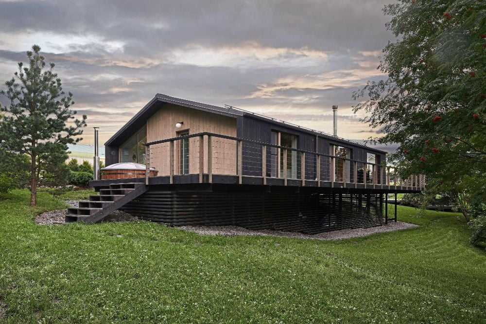 Modular house on slope side view.