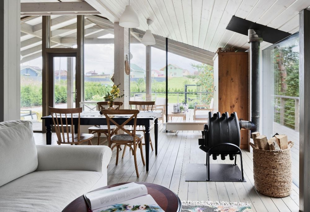 Modular house on slope living area connected to dining area.