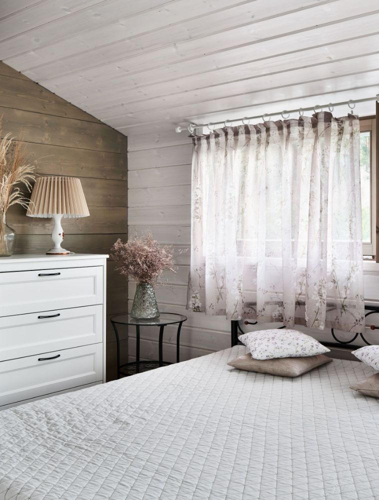 Modular house on slope bedroom with cabinet.