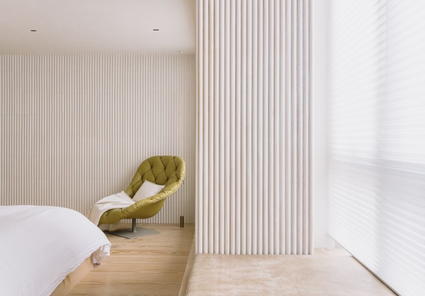 Urban cottage bedroom with single chair.