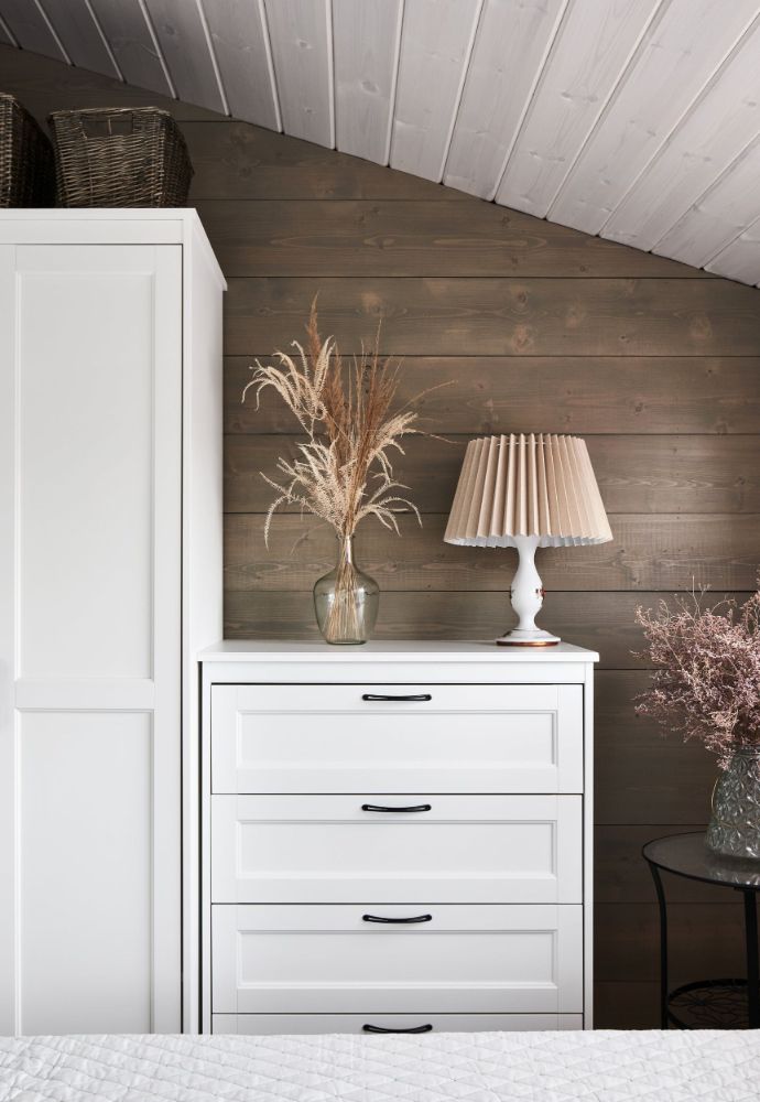 Modular house on slope cabinet with lampshade.