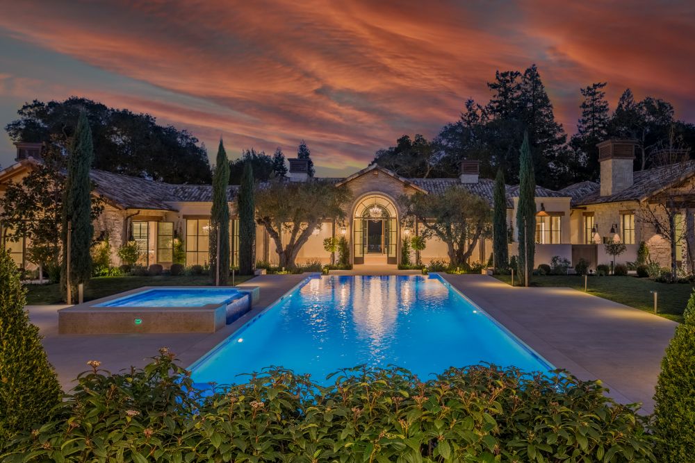 Night view of the front compound with direct look to the main home entrance.