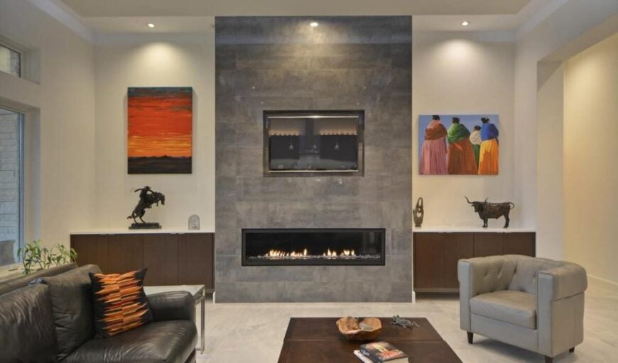 A modern fireplace flanked by base cabinets sets a nice focal point to the great room.
