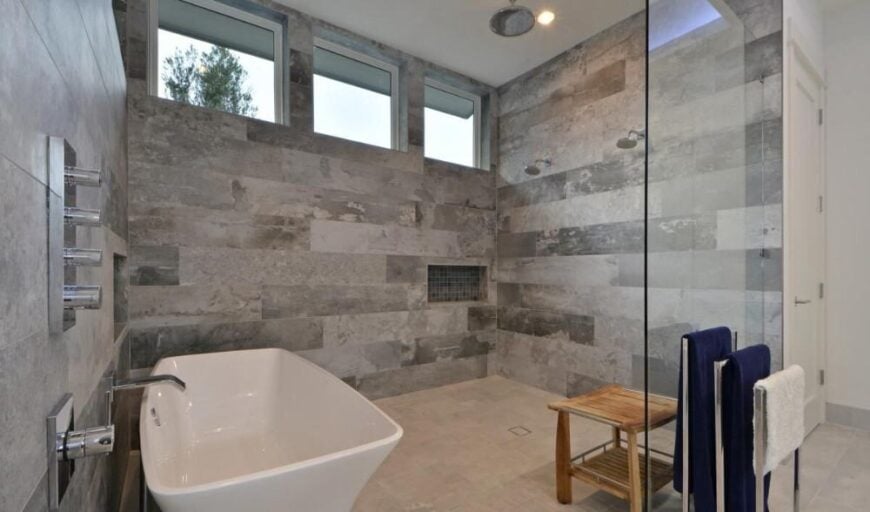 Clerestory windows brighten the spacious walk-in shower.
