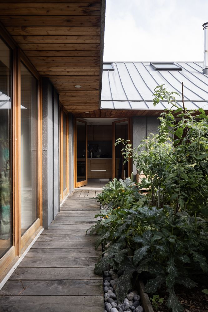 A path covered by overhanging roofs.