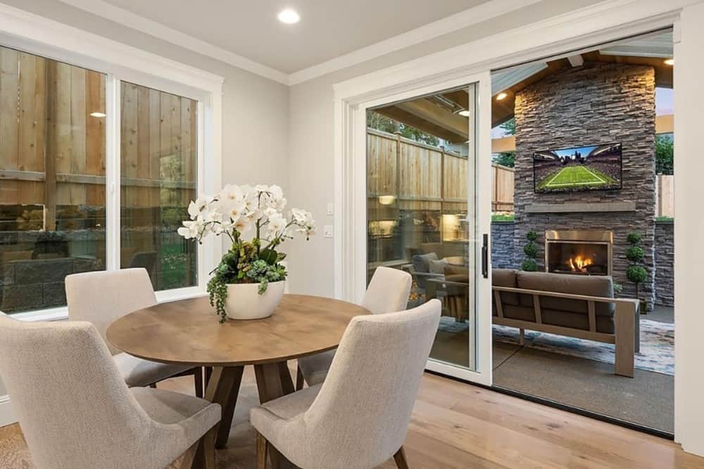 Sliding glass doors extend the breakfast nook onto a covered porch.