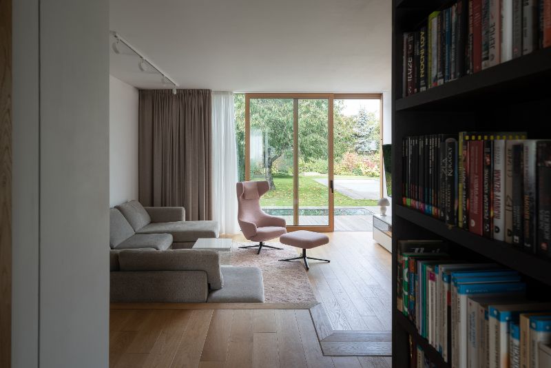 Cherry tree house living room with mini library.