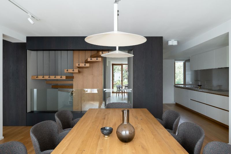 Cherry tree house dining area with hanging lights.