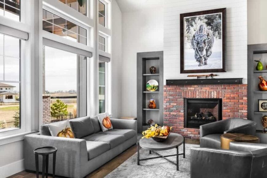 A wall of windows floods the family room with natural light.