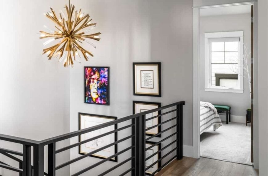 Main level balcony with wrought iron railings and a sputnik chandelier.Main level balcony with wrought iron railings and a sputnik chandelier.