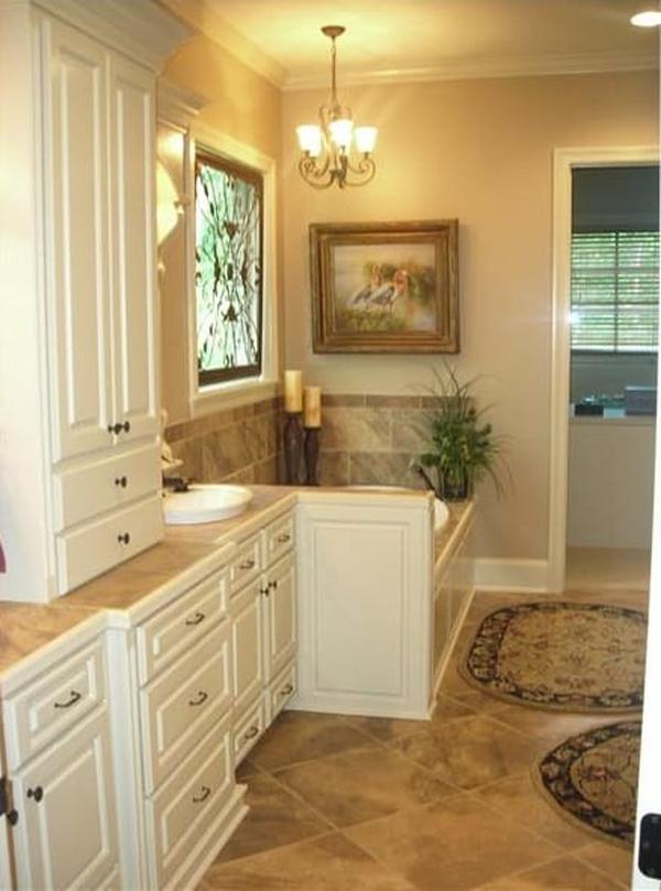 The primary bedroom has carpet flooring and a wrought iron bed complemented with a wooden table at its end.