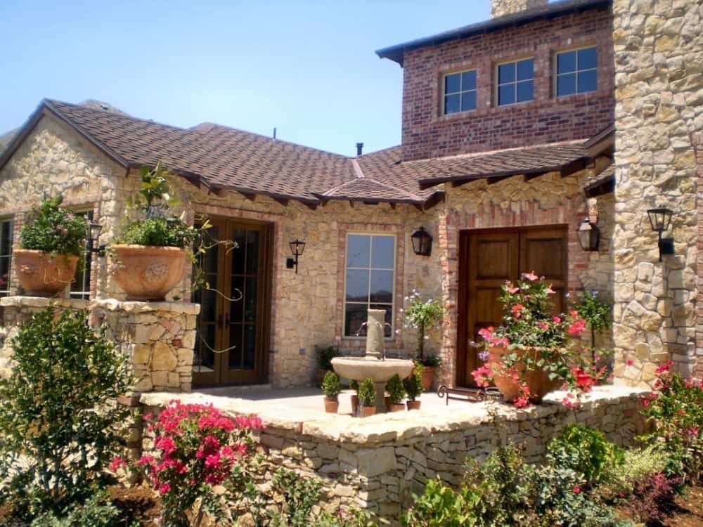 Angled front exterior showcasing its courtyard graced with a central fountain.