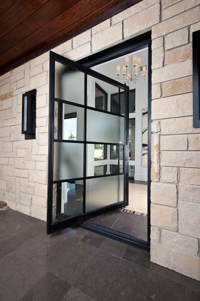 A pivot front door fitted with glass leads to the foyer.