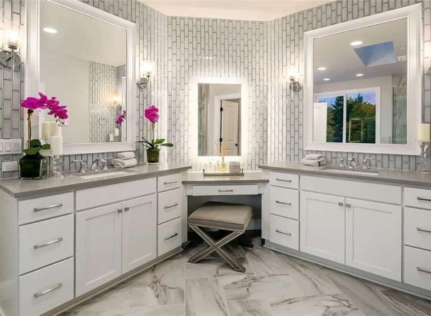 The primary bathroom includes a make-up counter flanked by his and her sink vanities.