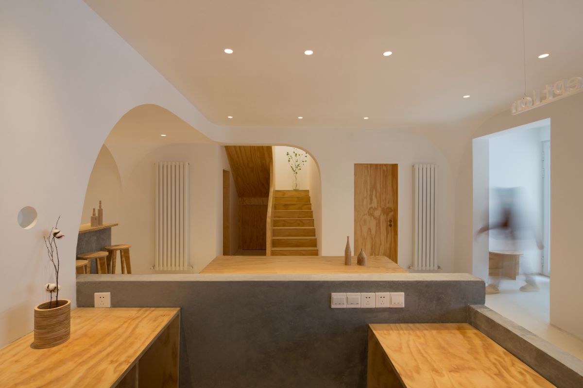 The main living area connected to the hard wooden stairs.