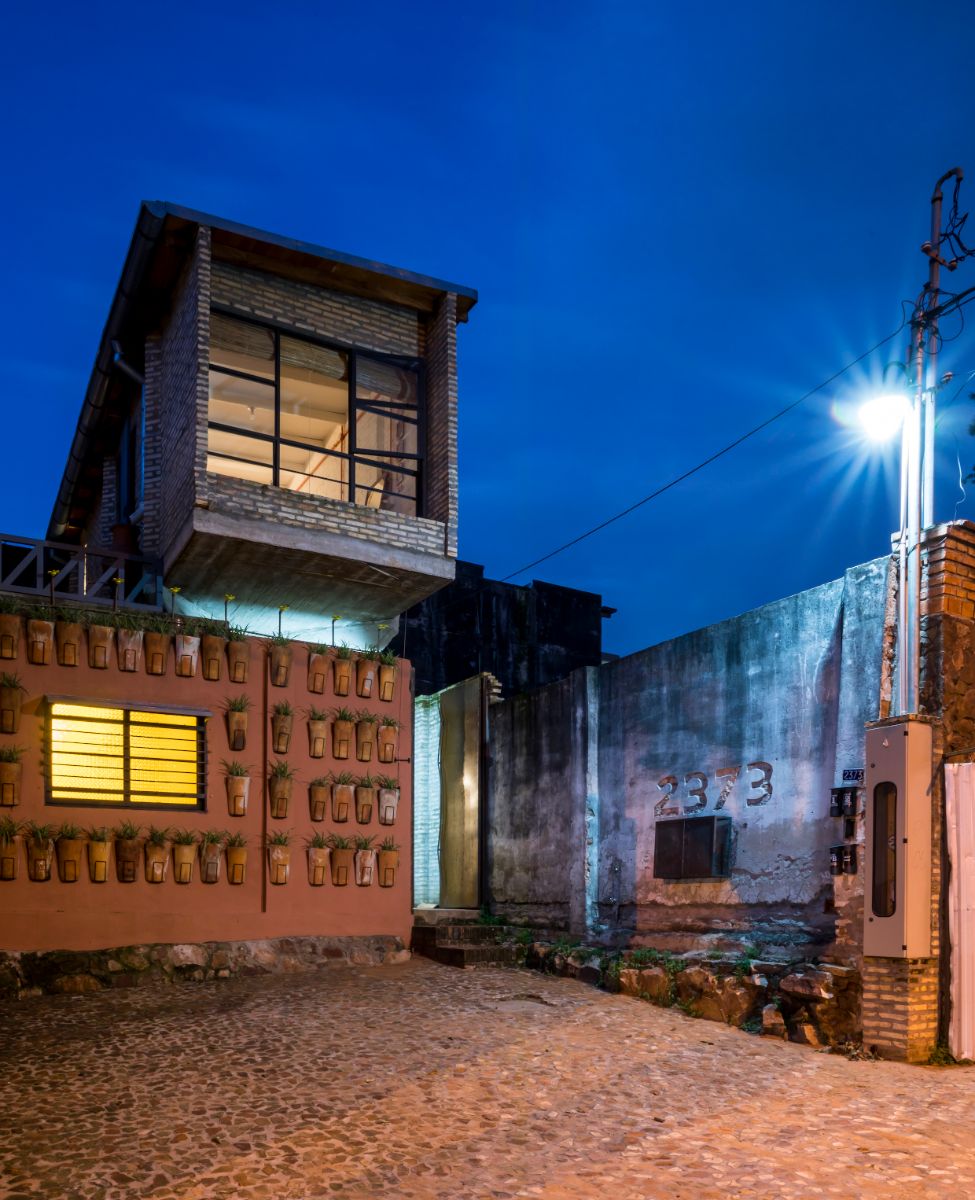 Full front view of the house at night.