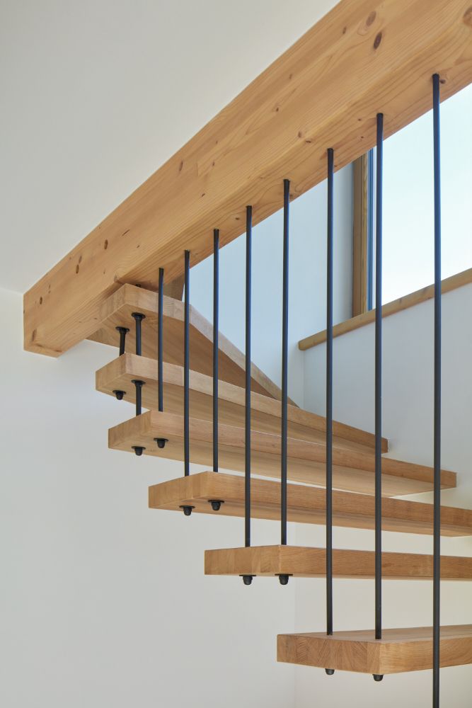 Customized wooden and steel spiral stairs.
